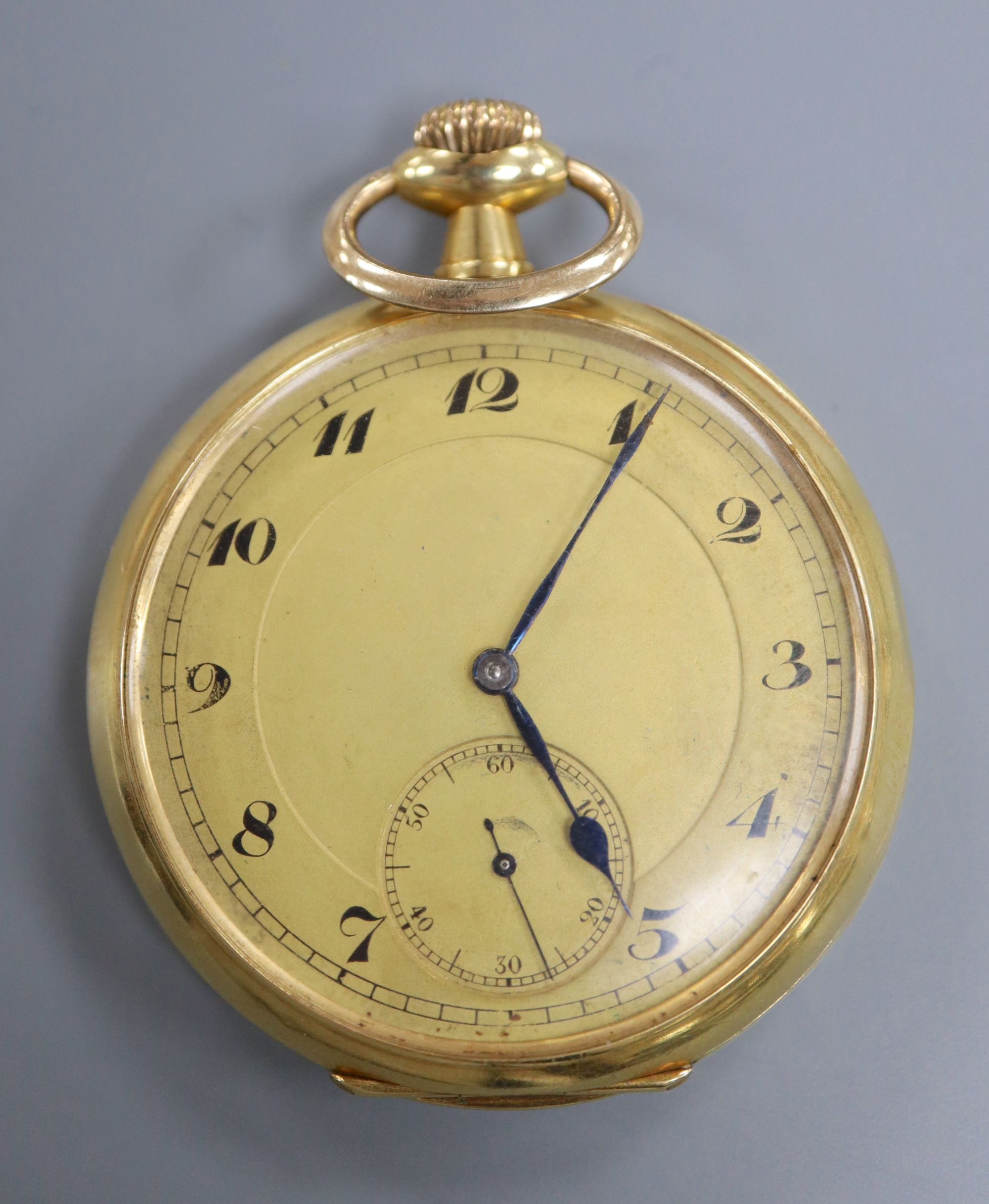 A continental 18k yellow metal open face pocket watch, with Arabic dial and subsidiary seconds,